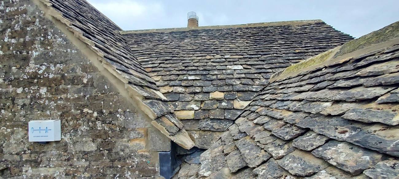 Cotswold stone slate roof close-up, valley and ridge detail